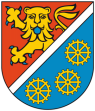Durch schräglinke silberne Leiste geteilt, vorn in Rot ein goldener, blau bewehrter und gezungter wachsender Leopard, hinten in Blau drei achtspeichige goldene Mühlräder bordweis